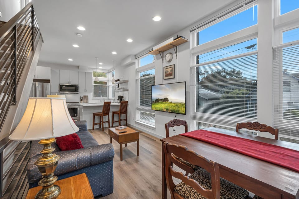 2nd level - kitchen, small dining, and living room with a 55" TV.