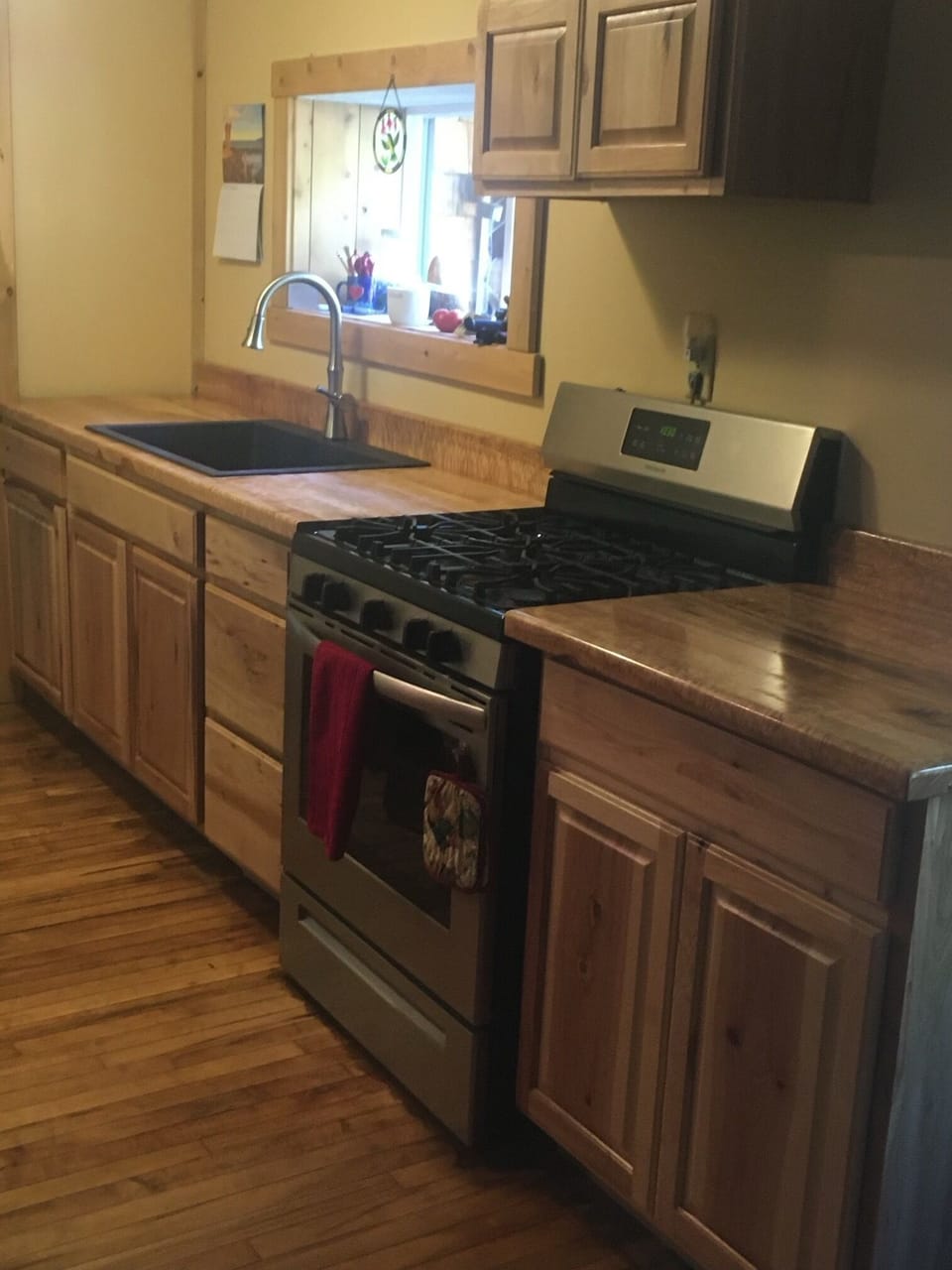 New appliances which include a gas range and refrigerator and new farmhouse sink