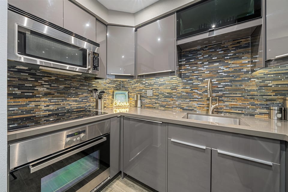 Full-size stove/range, micowave, and dishwasher (concealed in matching cabinetry