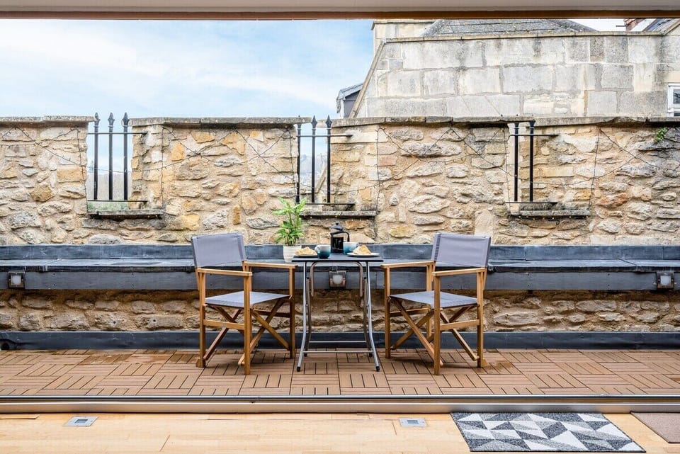 Sit back and relax in the sun! The private terrace is perfect for enjoying your morning coffee overlooking Bath, or a delicious home-cooked meal alfresco style! 