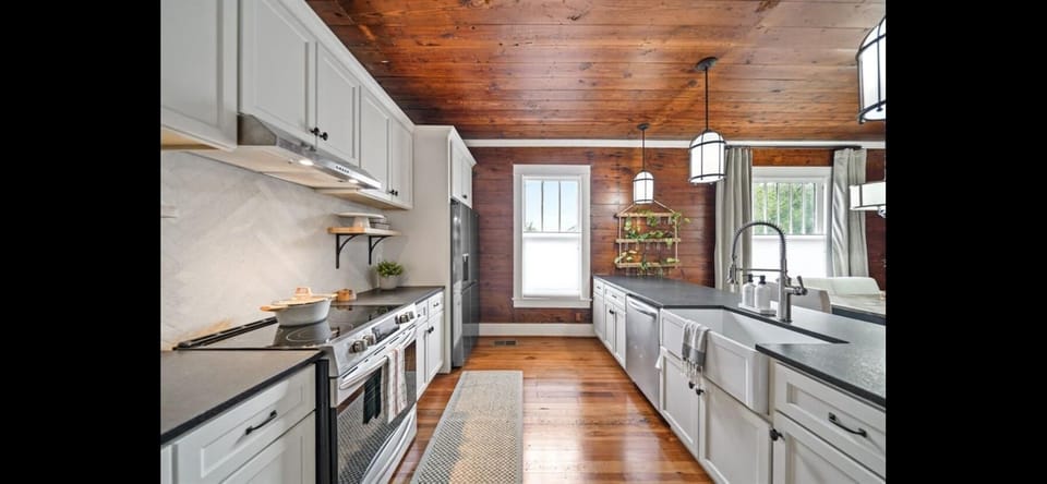 Fully equipped chef’s kitchen with stainless appliances and coffee bar