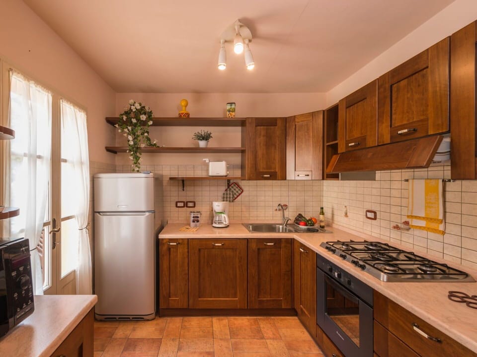 Cabinetry, Countertop, Property, Kitchen Sink, Sink, Kitchen Appliance, Kitchen Stove, Kitchen, Wood, Home Appliance