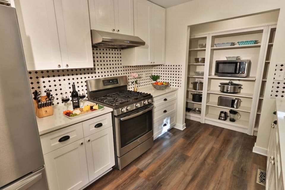 Kitchen with refrigerator, oven, and many other appliances
