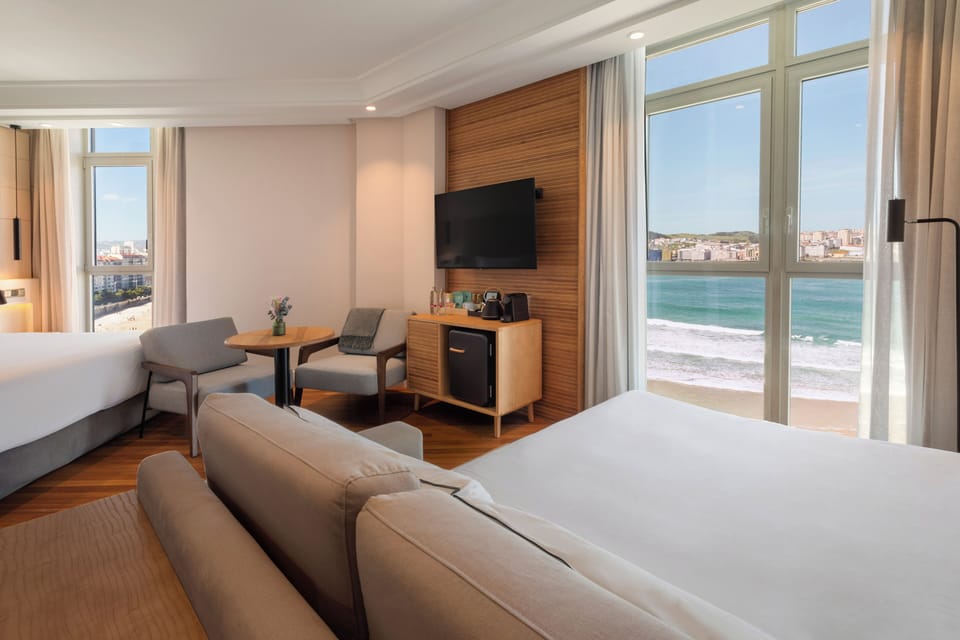 Junior Suite, Sea View | In-room safe, desk, blackout drapes, iron/ironing board