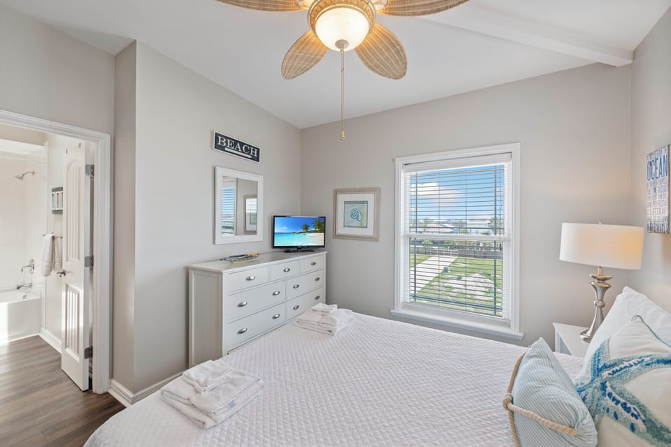 Coastal-inspired guest bedroom with light and airy furnishings.
