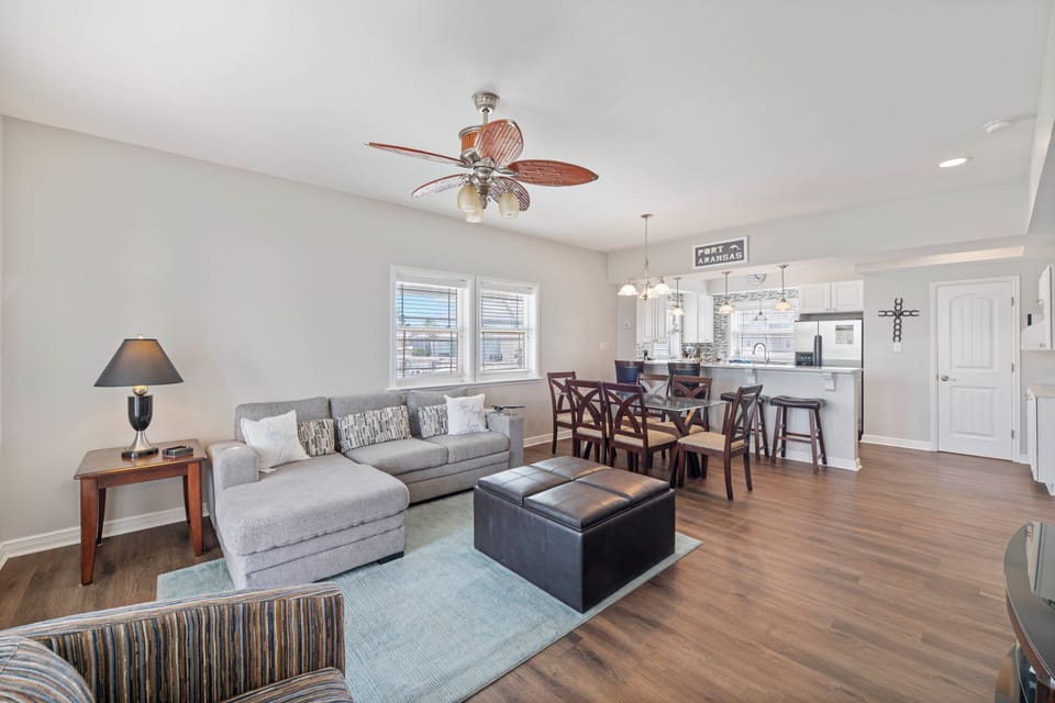 Your spacious open-concept living area on the second floor flows seamlessly from kitchen to dining, perfect for relaxing evenings with loved ones.