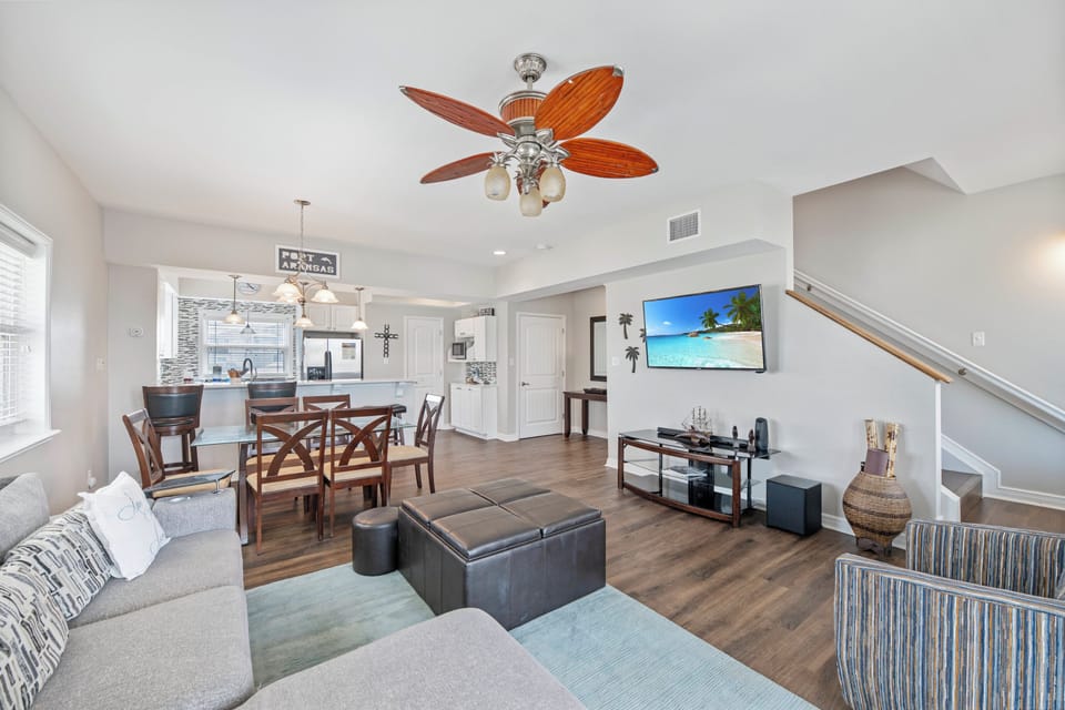 Relax in your spacious open-concept living area, where cozy seating and elegant dining create the perfect space for gathering.