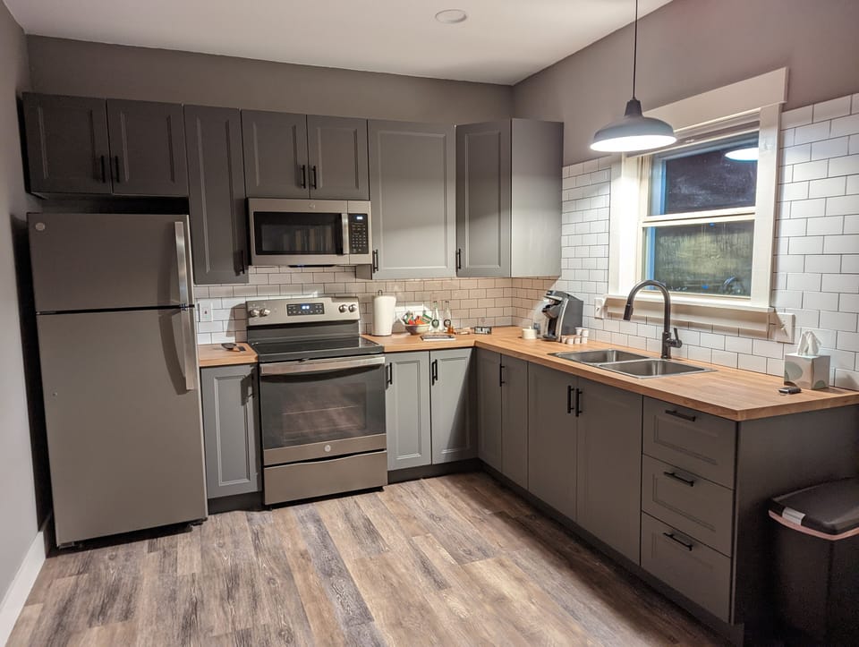 Full size fridge, Oven, Stovetop, Microwave, coffee maker, etc.
