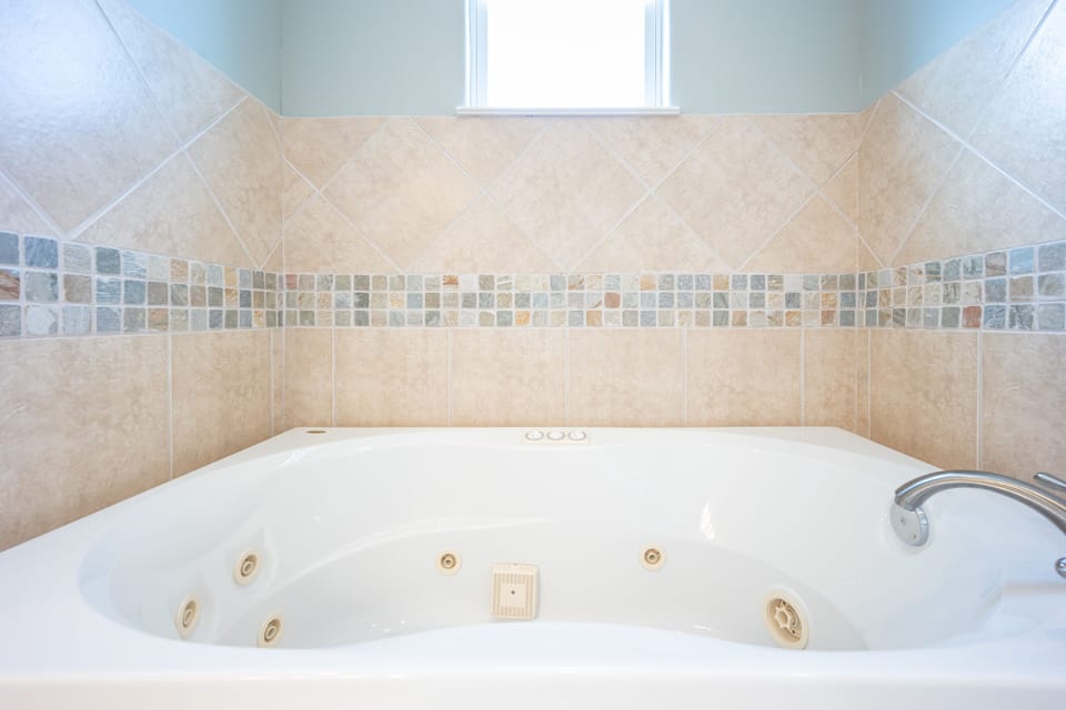 This en-suite bathroom also comes with a large bathtub and a shower (not shown).
