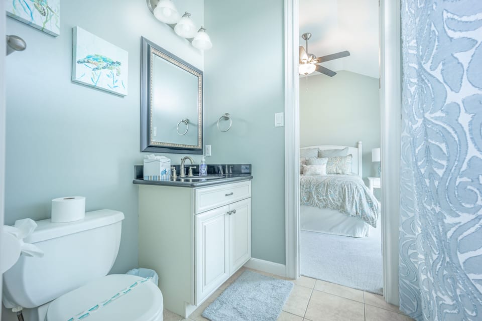 The second bathroom with a tub/shower connects with bedroom #2 and bedroom #3.