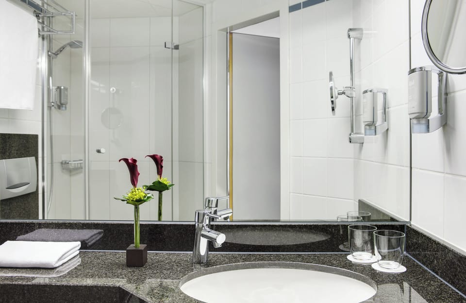 Shower, hair dryer, slippers, towels