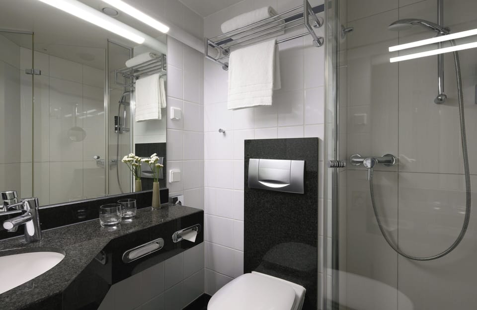 Shower, hair dryer, slippers, towels