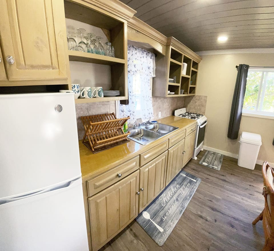 Full size open kitchen with everything you need for cooking at home.
