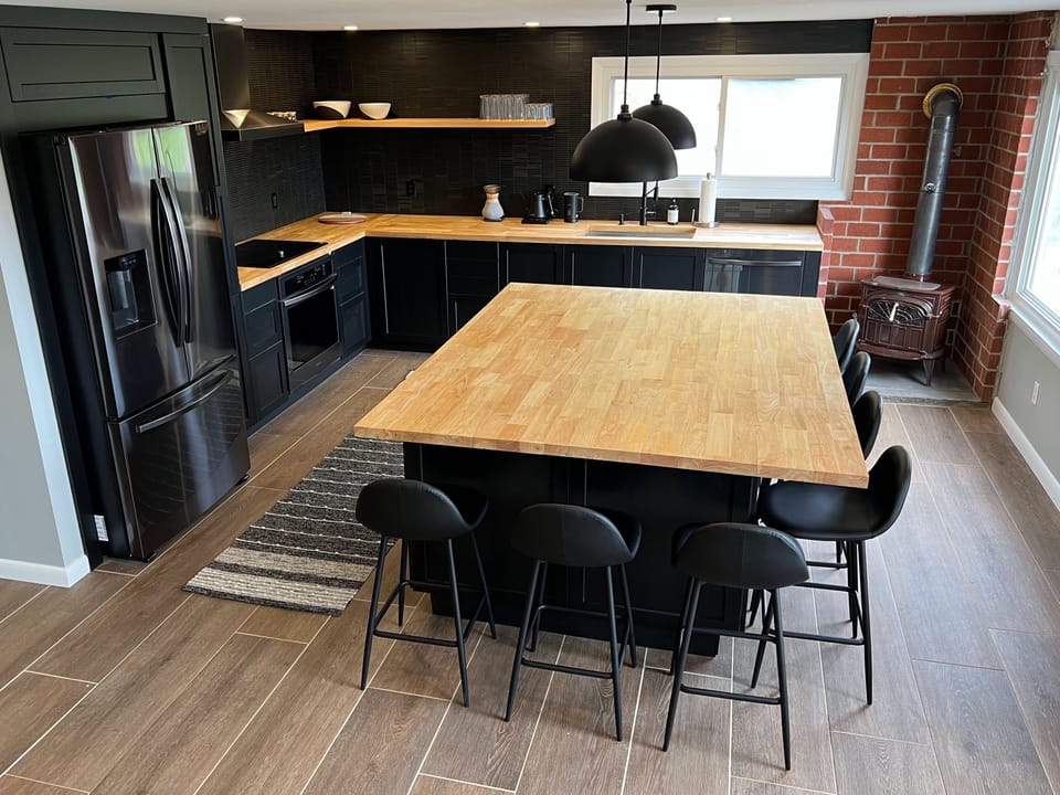 Recently renovated kitchen with heated floors, new appliances & 7ft island. 