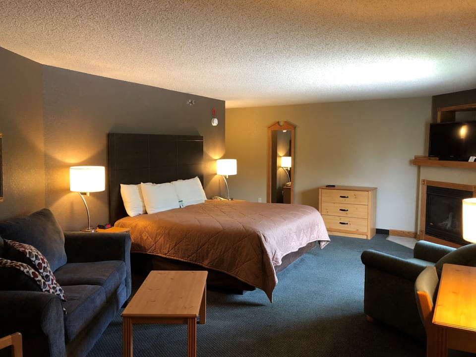 Grand Suite, 1 King Bed, Non Smoking | Desk, laptop workspace, blackout drapes, iron/ironing board