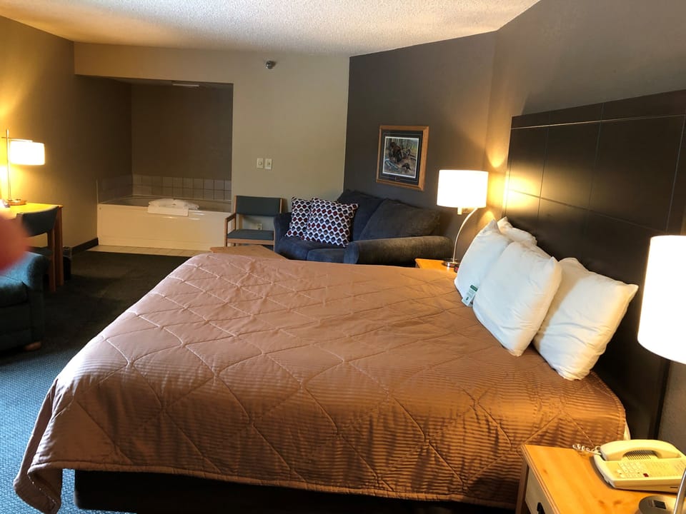 Grand Suite, 1 King Bed, Non Smoking | Desk, laptop workspace, blackout drapes, iron/ironing board