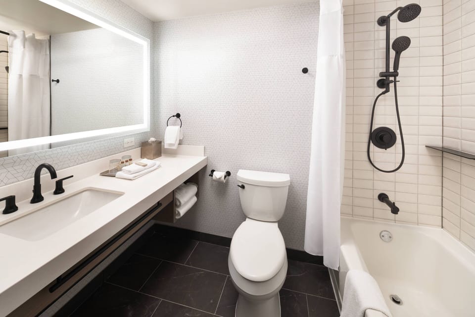 Combined shower/tub, designer toiletries, hair dryer, bathrobes