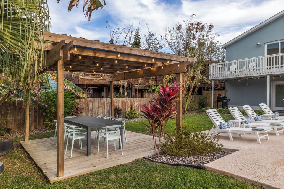 Pergola with dining for 10. Table expands and extra chairs in garage.