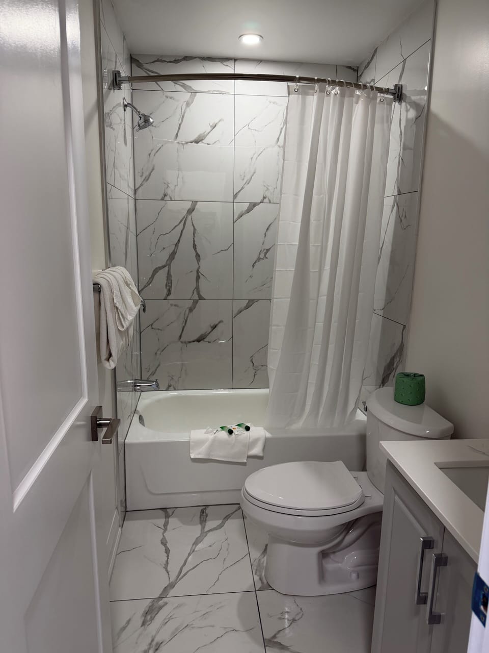 Room, 2 Double Beds | Bathroom | Combined shower/tub, free toiletries, hair dryer, towels