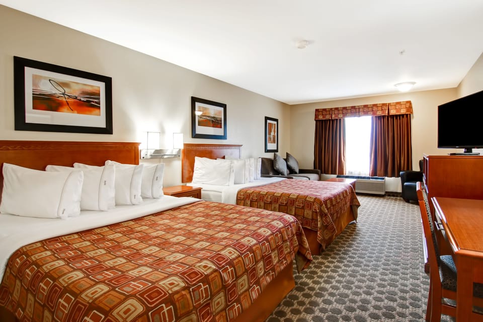 Premium bedding, pillowtop beds, desk, laptop workspace