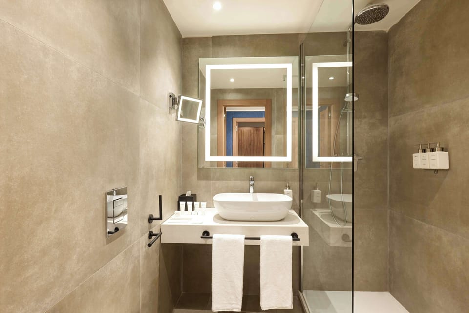 Suite, Non Smoking | Bathroom | Shower, rainfall showerhead, eco-friendly toiletries, hair dryer