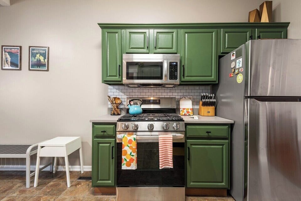 Cozy cooking nook with upgraded appliances and curated KC décor, ideal for guests exploring nearby Plaza, Westport, and downtown areas.