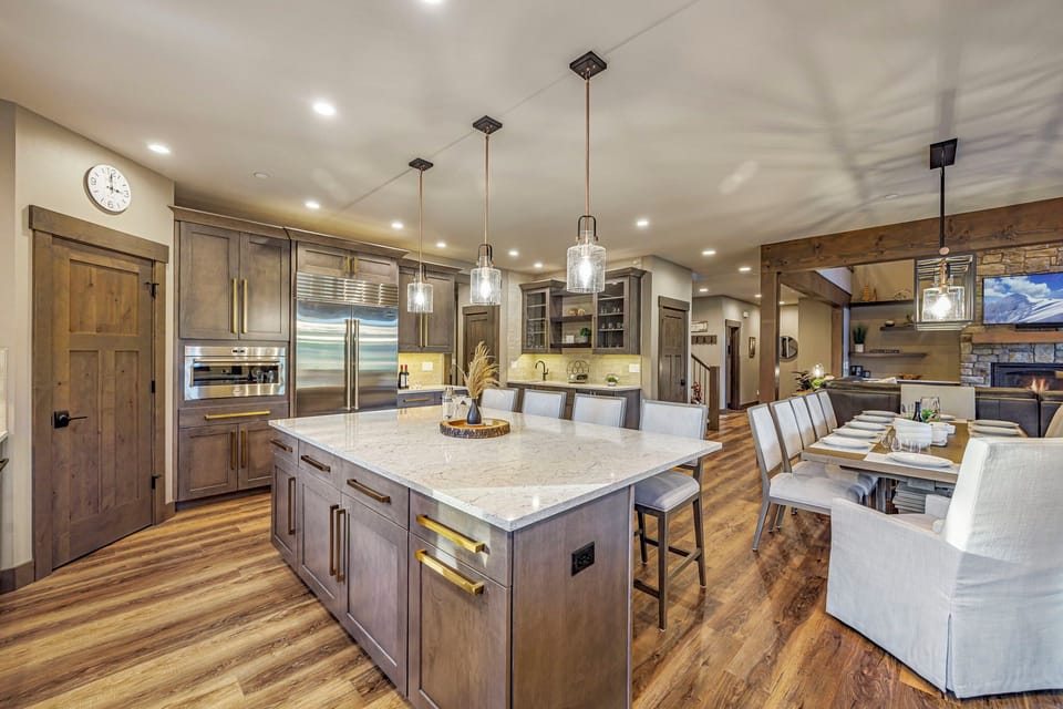 Great room from the dining area — vaulted ceilings & open-plan layout
