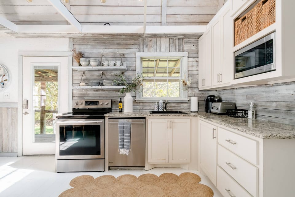 Full kitchen with stainless steel appliances