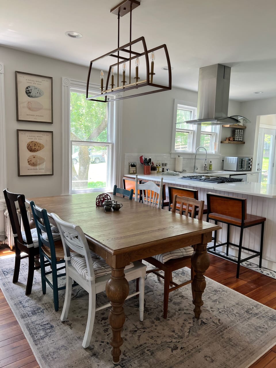 Breakfast bar and 8-person table provide plenty of seating. French door to deck.
