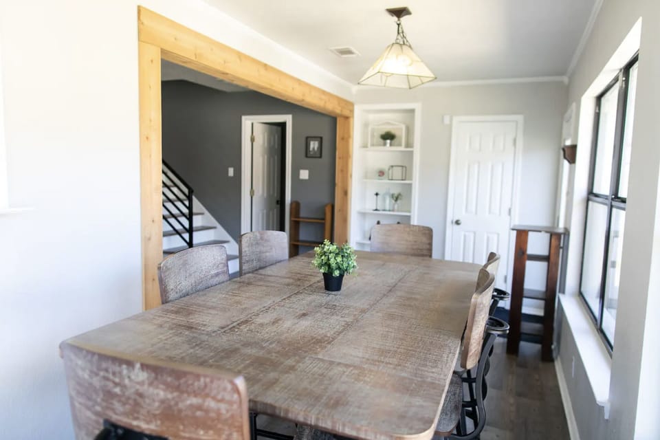 The dining table can seat up to 6 and the bar can seat 2.