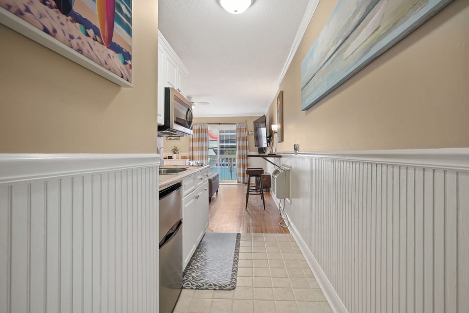 Your fully equipped galley kitchen features modern appliances and ample counter space for preparing meals during your stay.