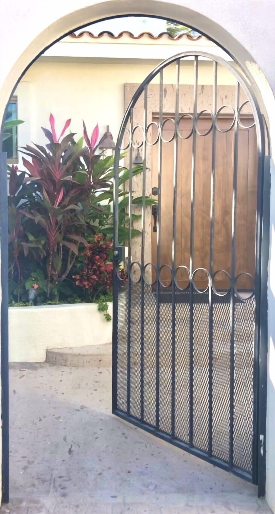 From the road, guests enter Casa Tropical through this locked gate