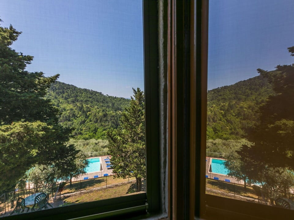 Sky, Building, Property, Window, Plant, Azure, Tree, Shade, Mountain