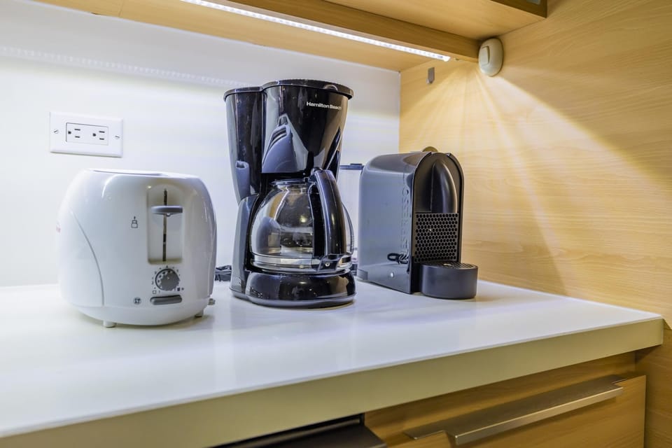 Enjoy the convenience of a coffee maker for that essential morning cup paired with a toast bread.