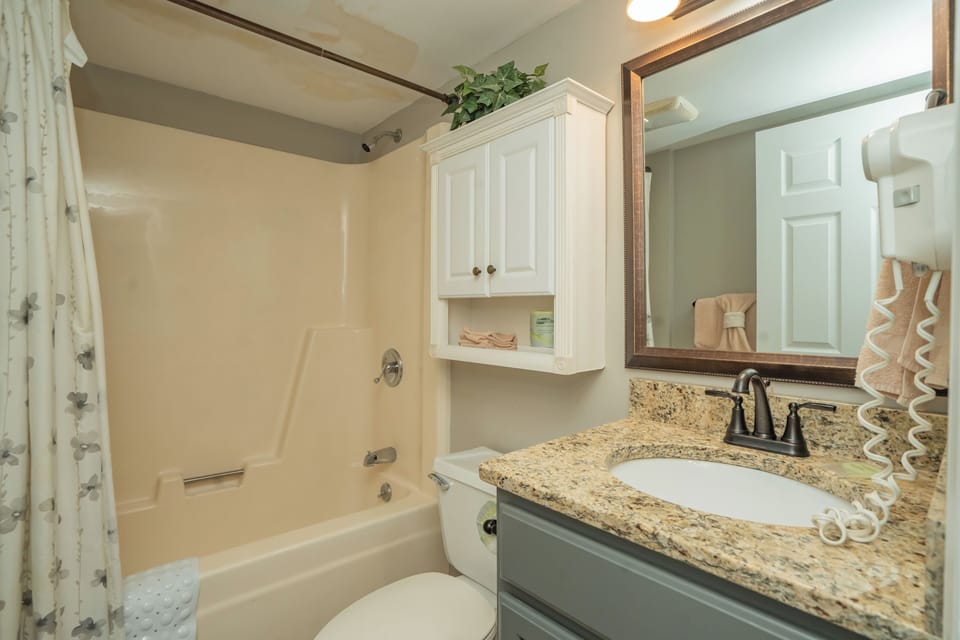 Step into your private bathroom with a granite-topped vanity, fresh towels, and a tub-shower combo—everything you need to unwind after a day of adventure.
