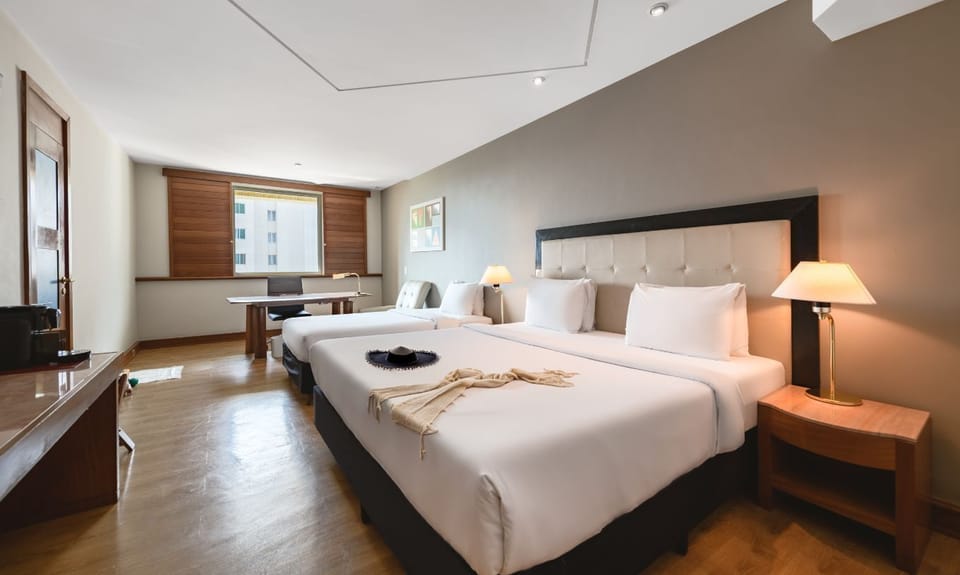 Family Room | Minibar, in-room safe, desk, blackout drapes