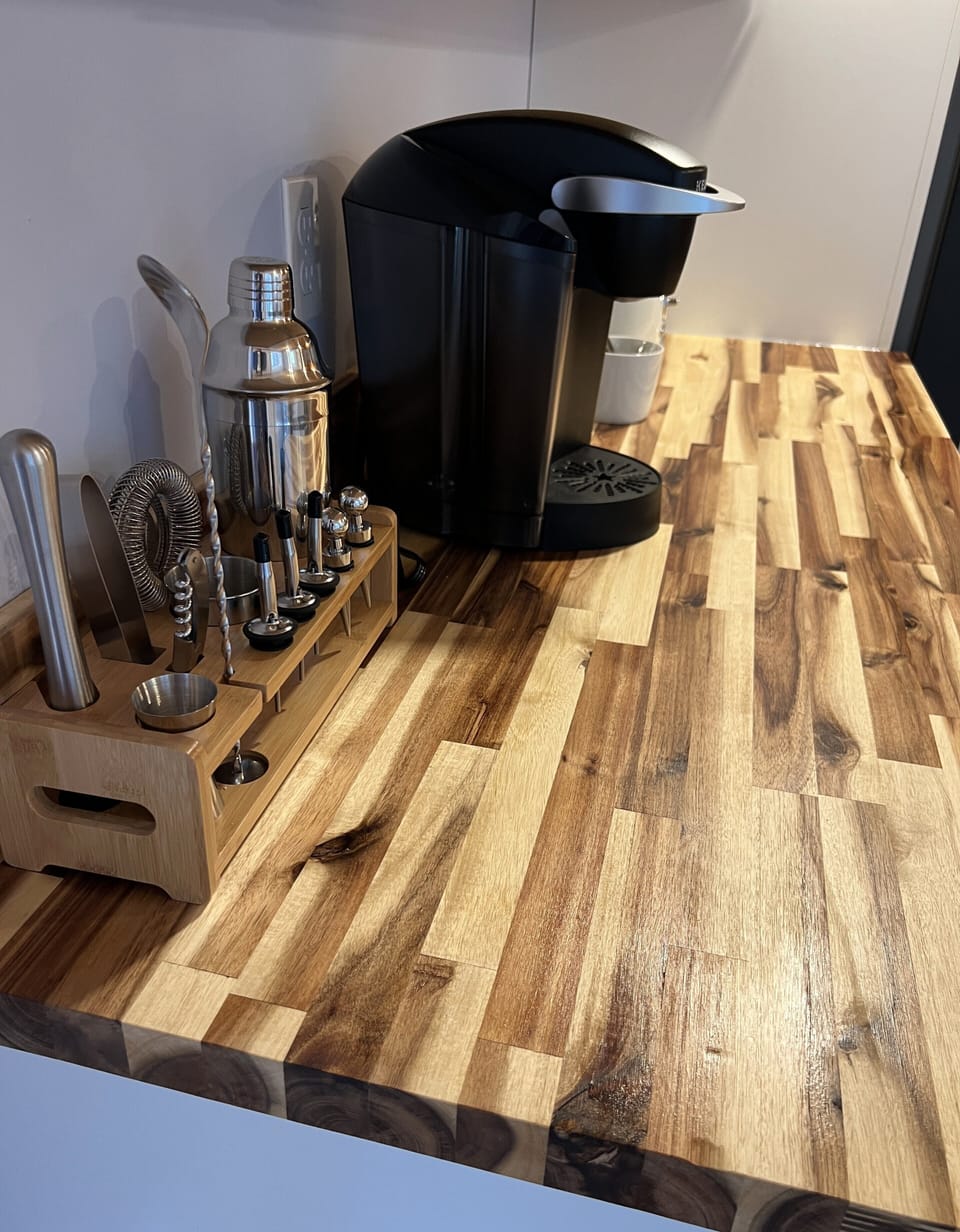 A coffee and drink station complete with K cups and sugar