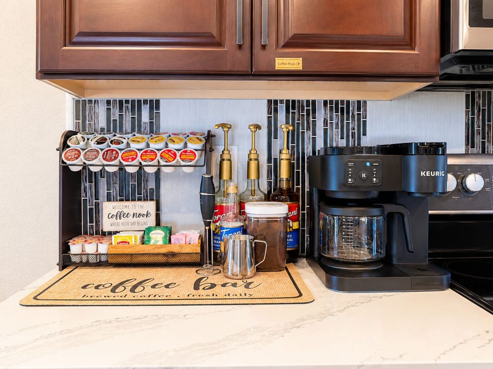 Indulge in the ultimate coffee experience at our coffee bar. Choose from an array of K-cups, enjoy the rich flavor of French press or drip coffee, or opt for a soothing cup of tea. Complete with an assortment of syrups and accoutrements.