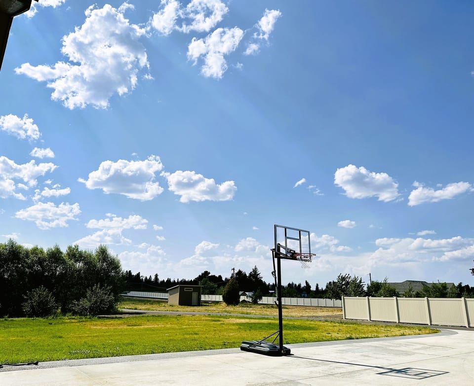 Unleash your inner athlete in our inviting driveway, where a basketball hoop awaits for endless hours of fun and friendly competition.