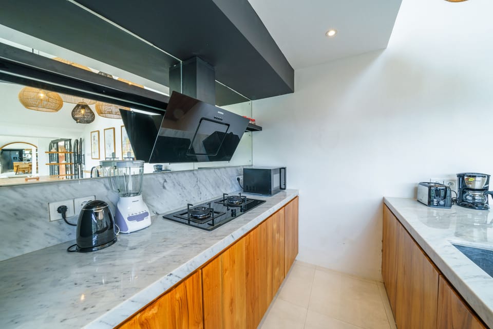 Deluxe Villa | Private kitchen | Full-size fridge, microwave, stovetop, coffee/tea maker