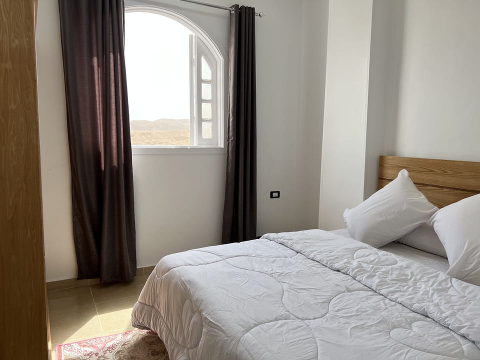 Egyptian cotton sheets, premium bedding, laptop workspace, free WiFi
