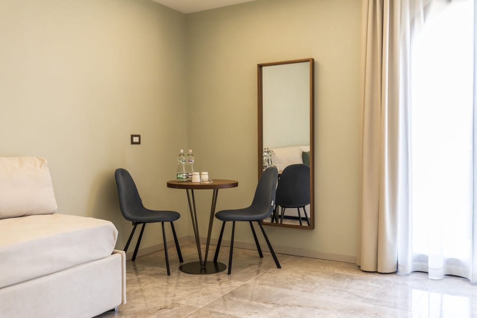 Basic Suite, 1 King Bed with Sofa bed, Balcony, Partial Sea View | Living area | 32-inch Smart TV with digital channels, TV
