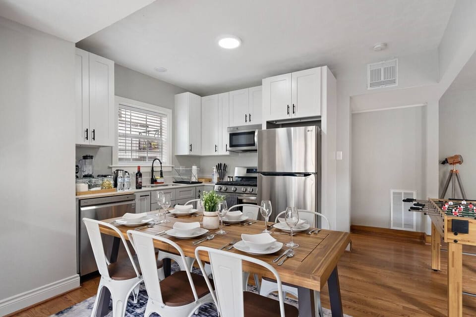 Spacious dining table that sits 6 with full tableware and silverware included.