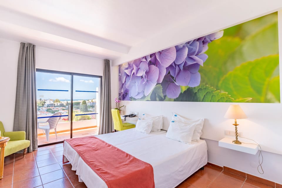 Twin Room, Pool View | Minibar, in-room safe, blackout drapes, free WiFi