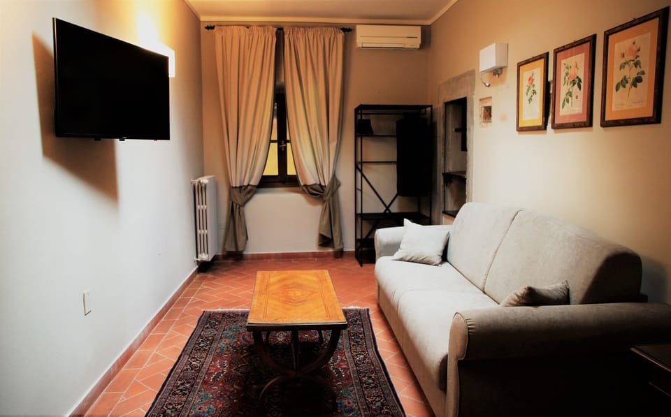 Junior Suite | Living room | Flat-screen TV