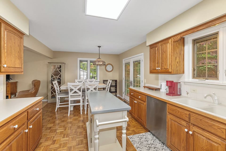 coffee maker, indoor, kitchen, dining table, daytime, dishwasher