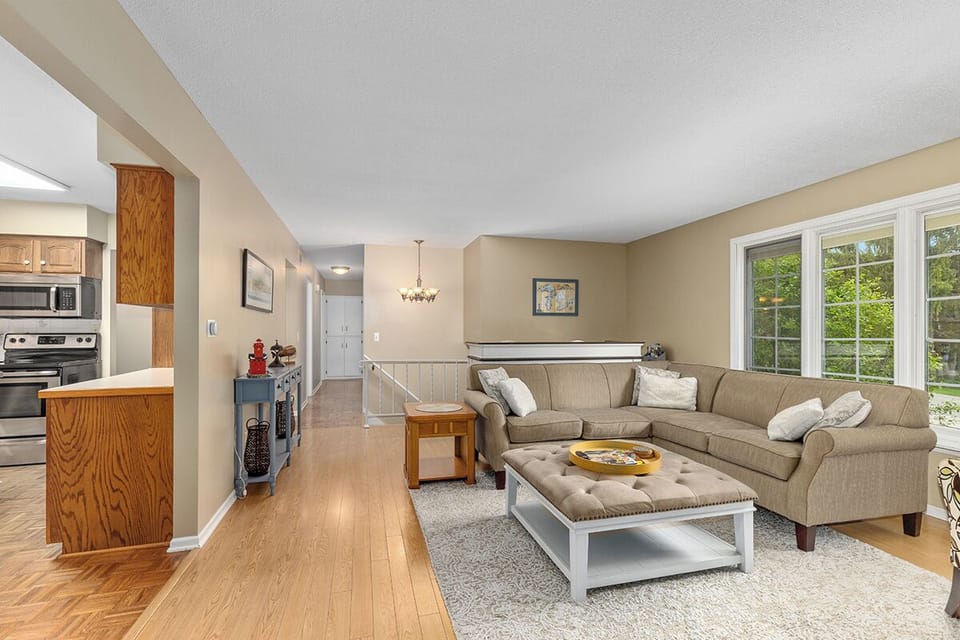 couch, interior, indoor, living area, accessibility, kitchen visible, daytime