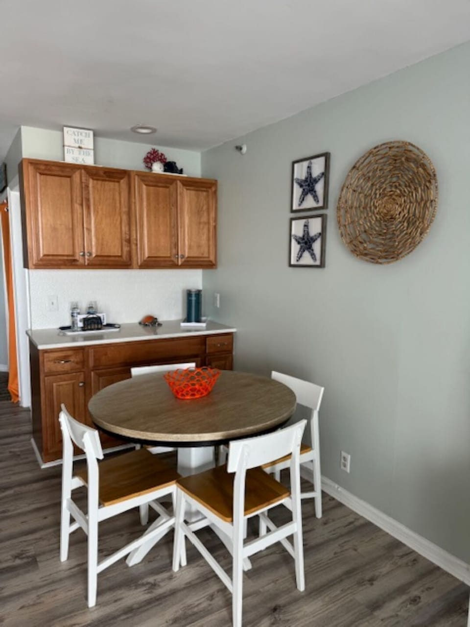 Dining table for four with 2 more adjustable stools at the counter
