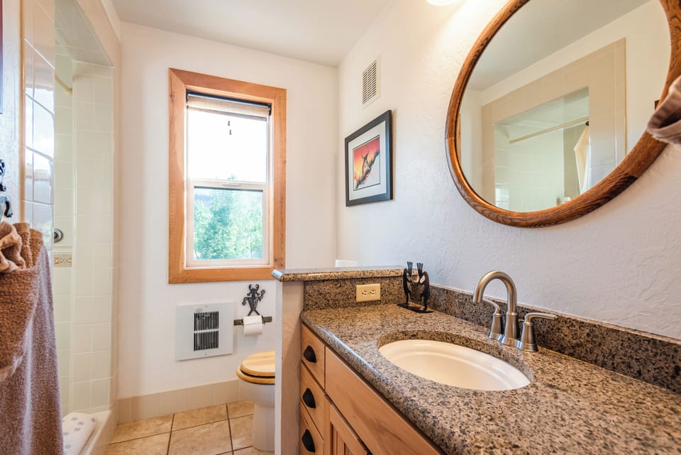 The bathroom on the main level has a shower.
