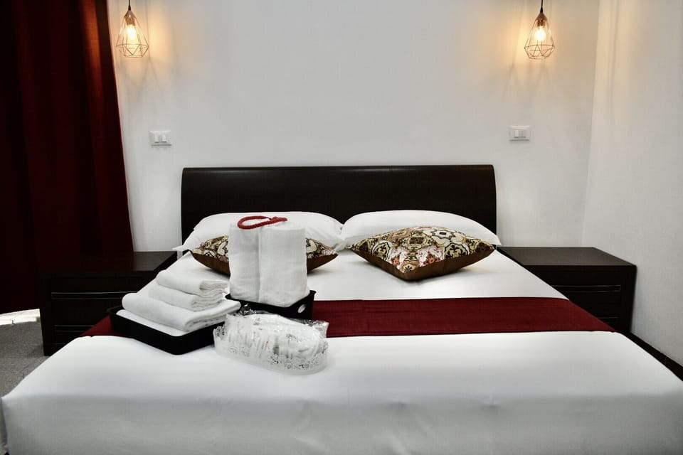 Standard Quadruple Room | Minibar, in-room safe, desk, iron/ironing board (on request)